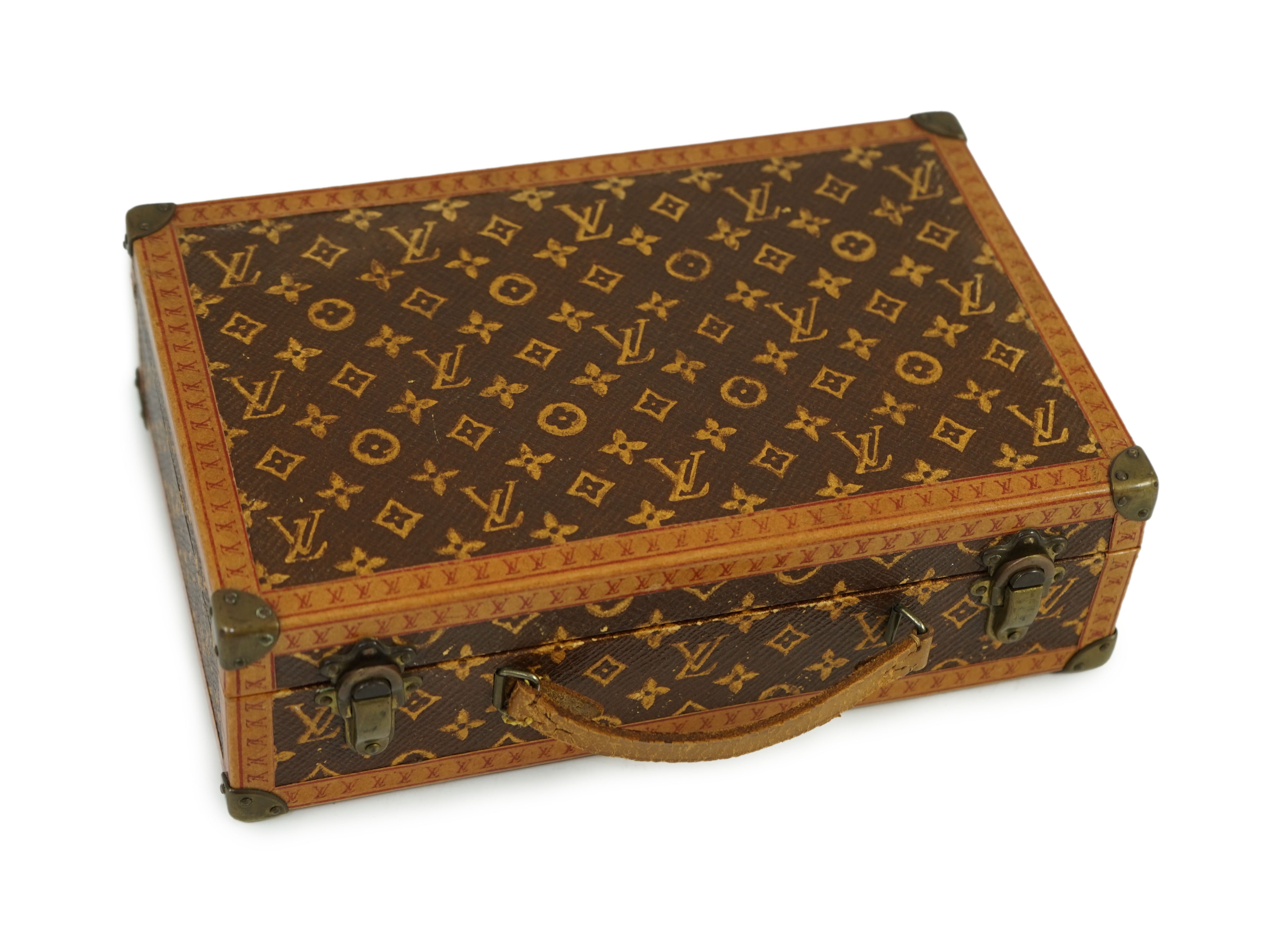 A 1920’s Louis Vuitton miniature suitcase, 20 x 13 x 6cm.